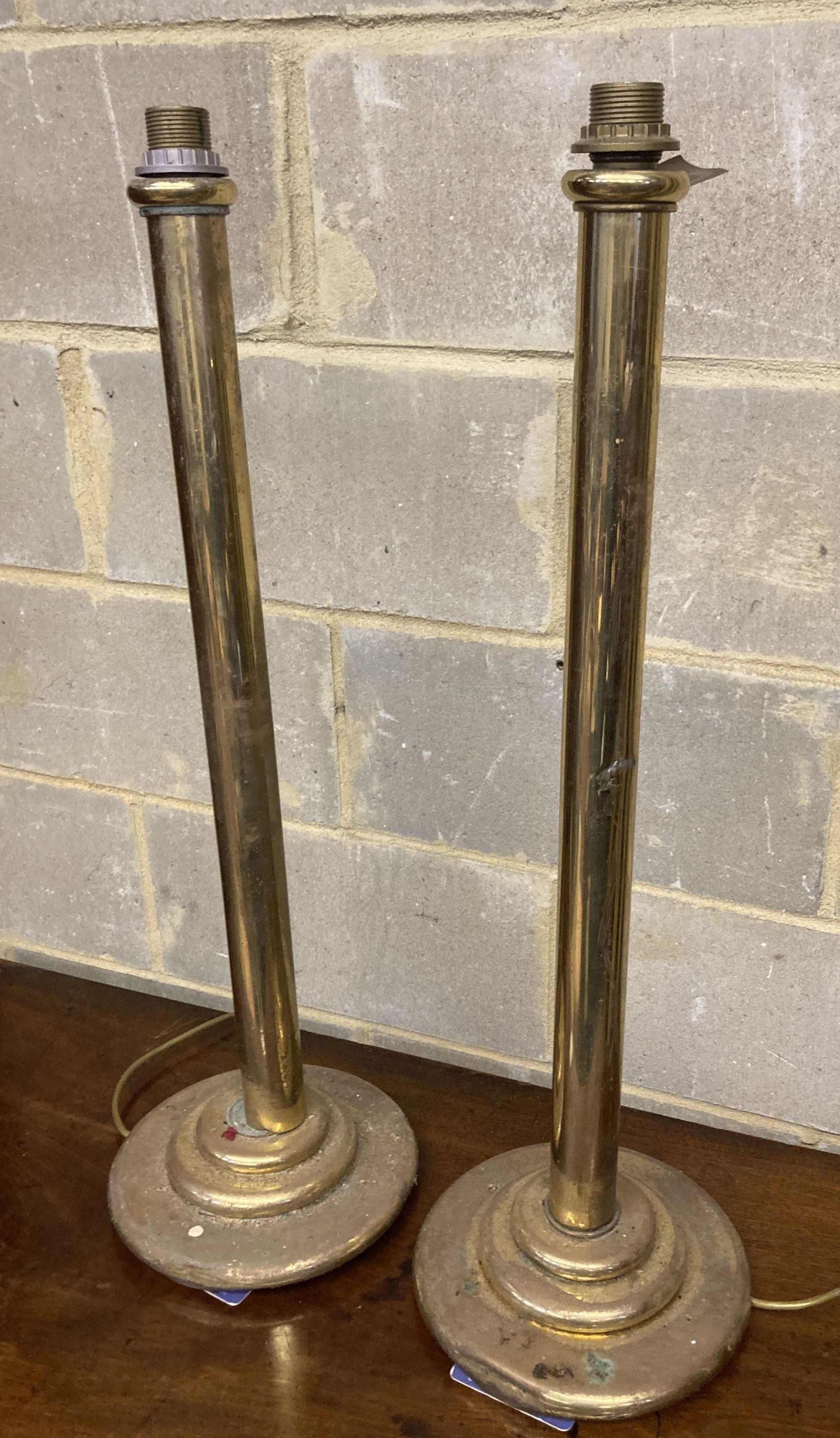A pair of brass floor lamps, formerly from the Brighton Grand, height 80cm